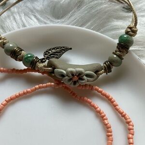One string floral bracelet and two seed bead bracelets